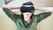 Medium close-up pleased woman wearing modern virtual reality mask and relaxing