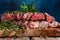 Medium cooked steak with rosemary close-up. Meat recipes and illustrations for meat recipes, recipe book