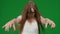 Medium green screen, chroma key shot of a posessed female, woman figure, ghost, poltergeist, zombie pulling her hands