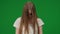 Medium green screen, chroma key shot of a posessed female, woman figure, ghost, poltergeist, zombie standing with her