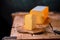 Medium hard cheese gouda edam on wooden board on sunlight table traditional table texture