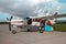 A medium-haul passenger plane with a propeller standing on the tarmac on a bright sunny day. Aircraft construction