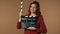 Medium isolated shot satisfied, happy and relaxed young woman holding an opened movie clicker, slate, clapperboard in