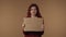 Medium isolated video of a sad, tearful and pity young woman holding a piece of cardboard that says \'need job