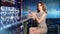 Medium long shot fashionable young woman wearing shiny dress sitting on bar with glass of wine