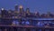 A medium shot of downtown Minneapolis and Bridges Spanning the Mississippi River during a Winter Twilight