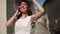 Medium shot of happy joyful young female tourist talking on phone standing on sunny summer day on Cyprus. portrait of