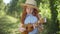 Medium shot portrait of happy skilled Caucasian redhead girl singing playing ukulele outdoors. Confident teenage