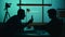 Medium silhouette video of a offender, perpetrator or prisoner sitting in the interrogation room in front of the