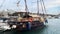 Medium Sized Old Wooden Fishing Boat Anchored At Harbor