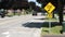 medium on speed hump arrow 20 km/h sign in black writing on yellow background