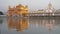 medium view of the famous golden temple at sunset in amritsar