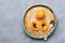 Medlar on a plate, gray background. Top view, copy space.