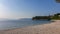 Medveja - A stony beach along the shore of Medveja in Croatia. The Mediterranean Sea is calm and clear