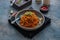 Mee goreng mamak, Indonesian and Malaysian cuisine, spicy fried noodles in a plate, copy space