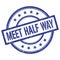 MEET HALF WAY text written on blue vintage round stamp