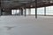 Meeting of group of builders and architects in empty warehouse.