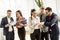 Meeting of group of businesspeople in the office standing in fro