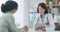 Meeting, woman and doctor with results on tablet in conversation with patient in office, clinic or healthcare. Medical