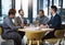 Meetings keep everyone on track. a group of businesspeople sitting in the boardroom during a meeting.