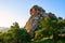 The megalith rock and trees sunset