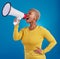 Megaphone, angry and screaming black woman in studio for message, broadcast or vote on blue background. Speaker