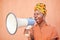 Megaphone, black woman or african protest, justice and freedom of speech for gender equality on orange mockup. Vote