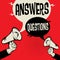 Megaphone Hand business concept Answers versus Questions