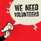 Megaphone Hand, business concept with text We Need Volunteers