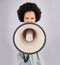 Megaphone, protest and black woman shouting in portrait in studio isolated on a white background. Screaming, angry and