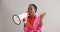 Megaphone, shout and excited black woman on gray background for news, announcement and information. Bullhorn