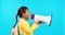 Megaphone, speech and girl child screaming in studio for back to school, deal or promo on blue background. Speaker, news
