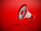 Megaphone standing on red background. 3D illustration