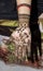 Mehandi Henna design on woman hands