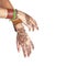 Mehendi or henna tatoo on the female hands in bracelets