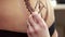 Mehndi. Master draws on girl\'s stomach using henna