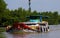 MEKONG DELTA, VIETNAM: DECEMBER 30. 2014: Overloaded sampan style boat with typical stylized bow eyes