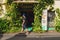 Melaka, Malaysia - March 22, 2016: Man walking on the green streets of Malacca town near the shop. Happy traveler in Asia