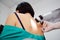 Melanoma diagnoinspectionsis. the doctor examines the patient`s mole