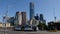 Melbourne, Australia - March 29, 2018: Tram going on Princess bridge with skyscrapers of Melbourne downtown in the background