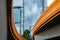 Melbourne Buildings through the curving and converging orange sides of Charles Grimes Bridge across Yarra River