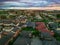 Melbournes suburbs and CBD looking down at Houses roads and Parks Victoria Australia. Beautiful colours at Sunset