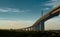 Melbournes Westgate Bridge against a dynamic blue sky and the vibrancy of colors from a low sun.