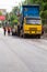 Melitopol, Ukraine, date May 27, 2017. Road workers about the truck, asphalt discharging into the back of the paver, road repair