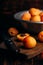 Mellow apricots with knife over cutting board