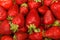 Mellow red strawberries background close up