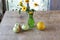 Melon, apples and a bouquet of yellow daisies