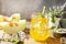 Melon lemonade in glasses with ice and mint on a wooden rustic table. Fresh refreshing fruity summer drink, seasonal beverages.