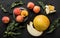 Melon and peaches. Creative layout made of fruits. Colorful fresh fruit on black stone background. Top view