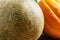 Melon and watermelon on an old wooden table, selective focus